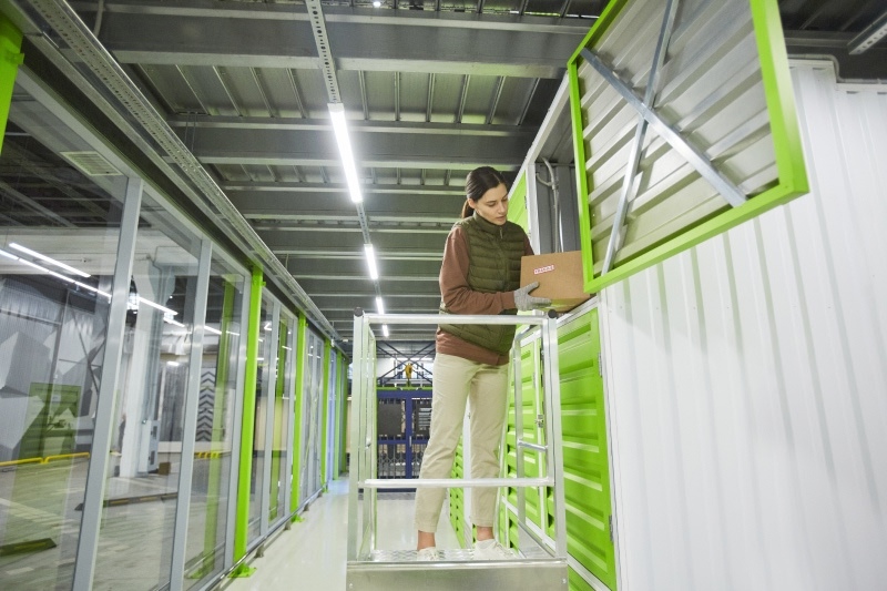 person-standing-on-a-green-railing-2026-03-20-01-02-52-utc 1